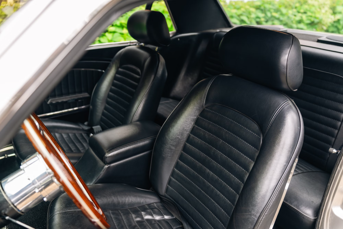 Ford Mustang bitcoin, crypto, luxury vehicles front seat